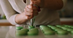 Woman filling in the cupcakes