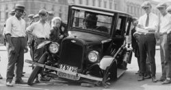 Vintage black and white photo of a car accident