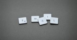 Scrabble letters on a table spelling "email"