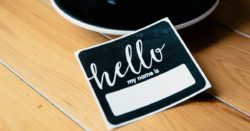 Blank greeting card inviting person to write their name in